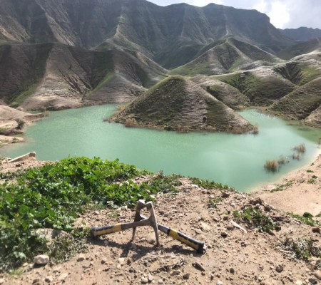 Rock hammer overlooking a mountain lake